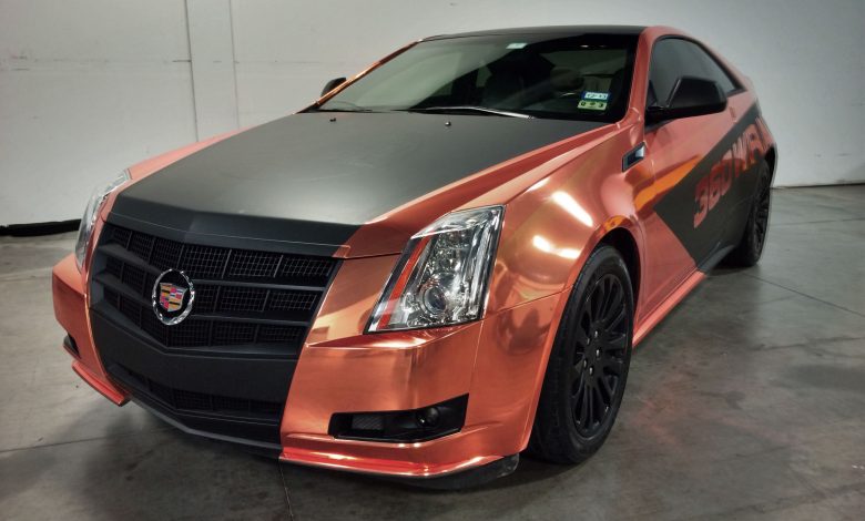 This beautiful Cadillac CTS coupe was given a custom wrap using Avery Gold Chrome conformable wrap film and Avery matte black Supercast film.
