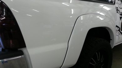 The subject vehicle is a Toyota Tacoma pickup truck. It has medium-size fenders with a rubber gasket in between the fender and b