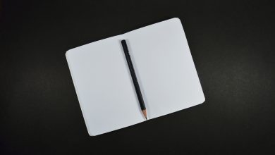 blank book pad of paper and pen