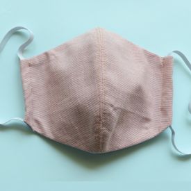 Apparel companies around the industry turn their attention to making face masks for those in need. (Image: Adobe Stock)