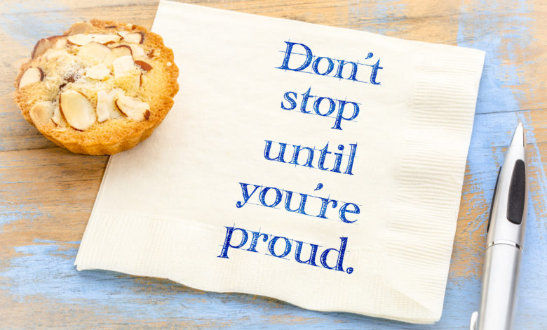Do not stop until you are proud - inspirational handwriting on a napkin