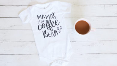 baby shirt on wooden background