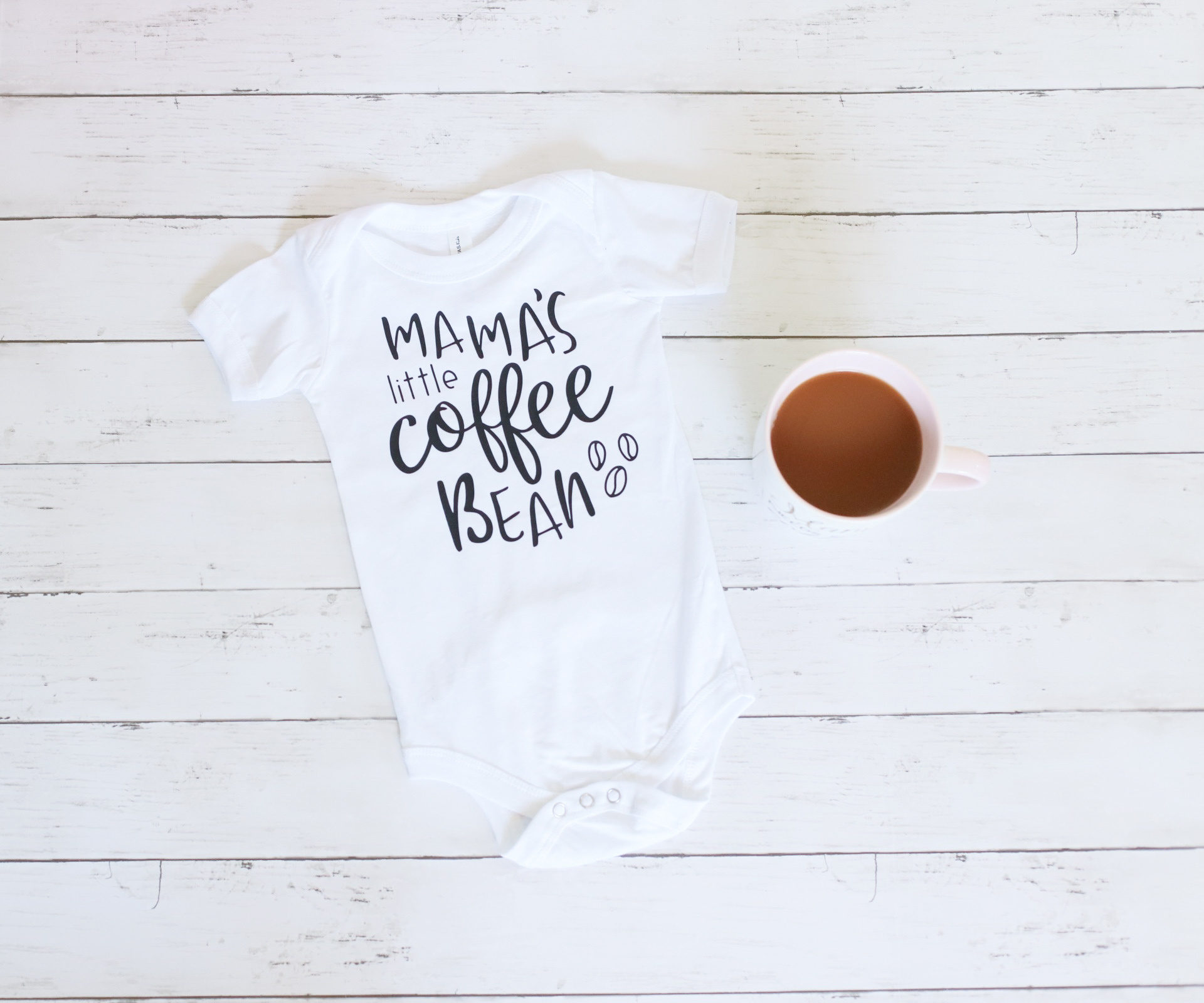 baby shirt on wooden background