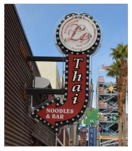 Thai noodles and bar sign