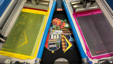 Vegas-themed trade show shirts being screen printed