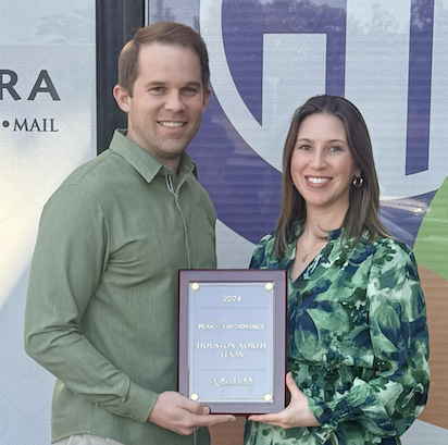 Stuart and Chelsea Wilson pose with the award. Image courtesy of Allegra Marketing Print Mail