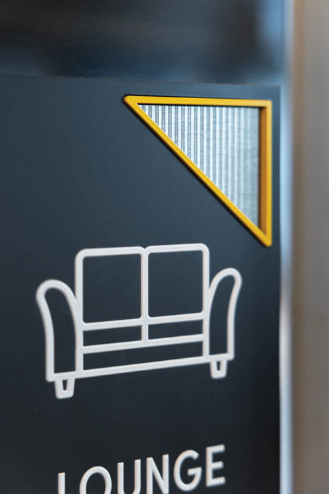 Close up detail of corrugated metal laminate on an amenity sign. Photo Taken by Megan Morales