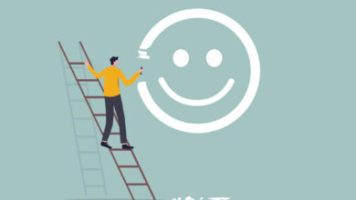 Happiness and positive thinking, optimism or motivation to live happy life concept, happy boy climb up ladder to paint smile face on the wall. workplace culture.