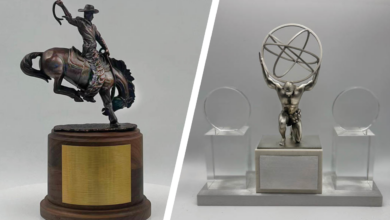 recognitions cowboy bronc rider award and man holding globe award