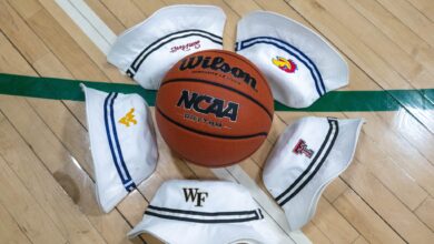 hats with college logos surrounding basketball - Image courtesy of Imperial