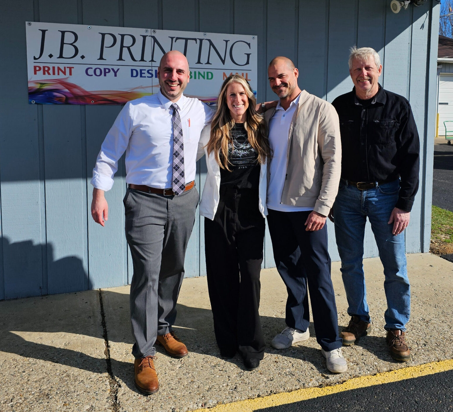 Jess Luepke, Mike Luepke,John O’Keefe, and Rich DeRosa (Image courtesy of Minuteman Press)