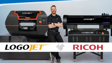 man standing between Ricoh and LogoJET printers