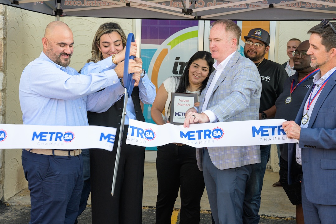 Owners Nasmah Alsalihi and Houmam Al-Shalchi take part in a ribbon cutting to celebrate the new location of their business Image360 San Antonio.