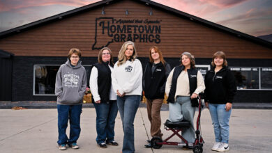 Left to right: Finley Bullock (DTF & POD specialist), Krystie “Lue” Lubek (screen print specialist), Cassie Evans (president/owner), Danny Larsen (embroidery specialist), Kristy Ahdel (operations manager & client services coordinator) Makaelyn “Mak” Ellison (quality coordinator & creative specialist)