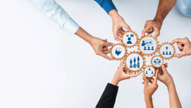 A dynamic visual representation of teamwork, showcasing diverse hands collaborating with graphic gear icons, symbolizing innovation and business strategy on a light background. training