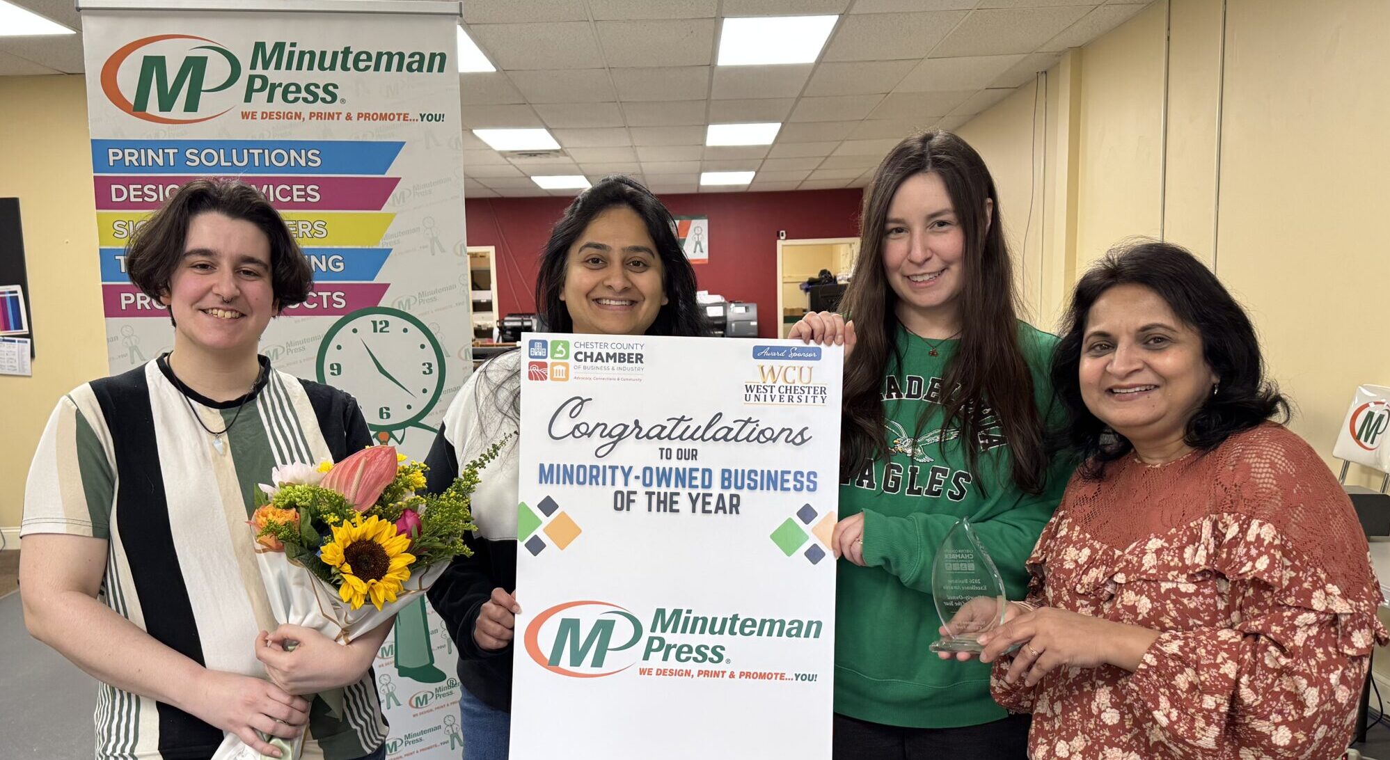 Jyoti Arora (right) celebrates with her team after Minuteman Press in Chadds Ford, Pennsylvania, was named Minority Business of the Year.