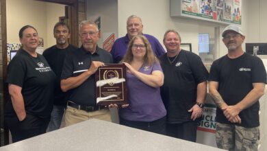 Minuteman Press Franchise Owner Ken Holloway (third from left) and his team in Columbia, South Carolina, celebrate their President’s Club Award.