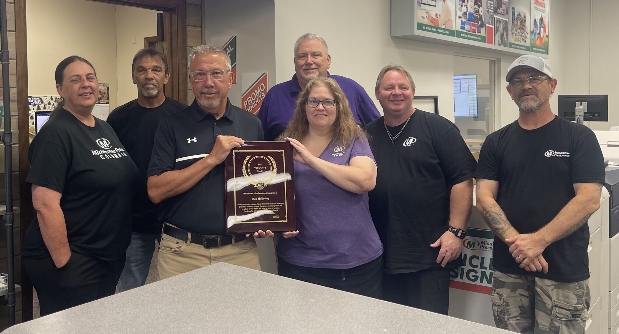 Minuteman Press Franchise Owner Ken Holloway (third from left) and his team in Columbia, South Carolina, celebrate their President’s Club Award.
