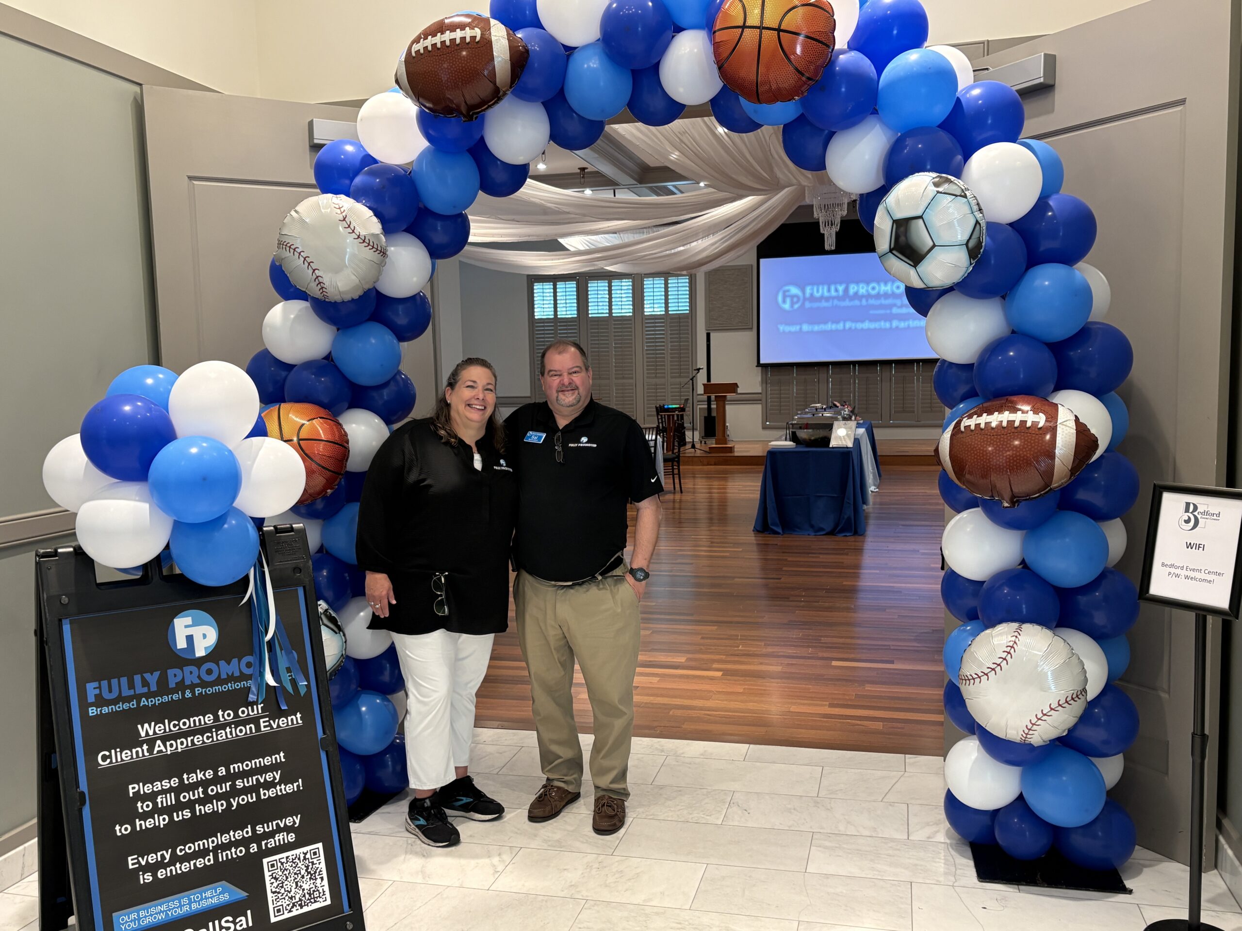 Jennifer and Sal Calautti, owners and operators of Fully Promoted of Southern NH welcome the NH business community to their 3rd annual Client Appreciation Event; festive balloon décor by Eye Candy Balloons