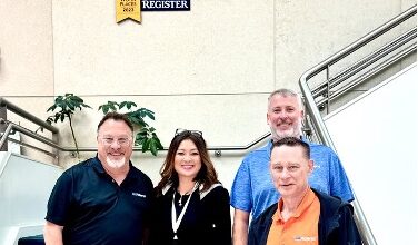 Pictured at Roland DGA headquarters (from left): Dan Johansen, Vice President of Business Development, Roland DGA; Susan Cox, Founder & CEO, LogoJET; Sid Lambert, Director of Sales, Roland DGA (rear); and Dan Burmeister, CEO/President, Roland DGA (front right). Photo courtesy of LogoJET.